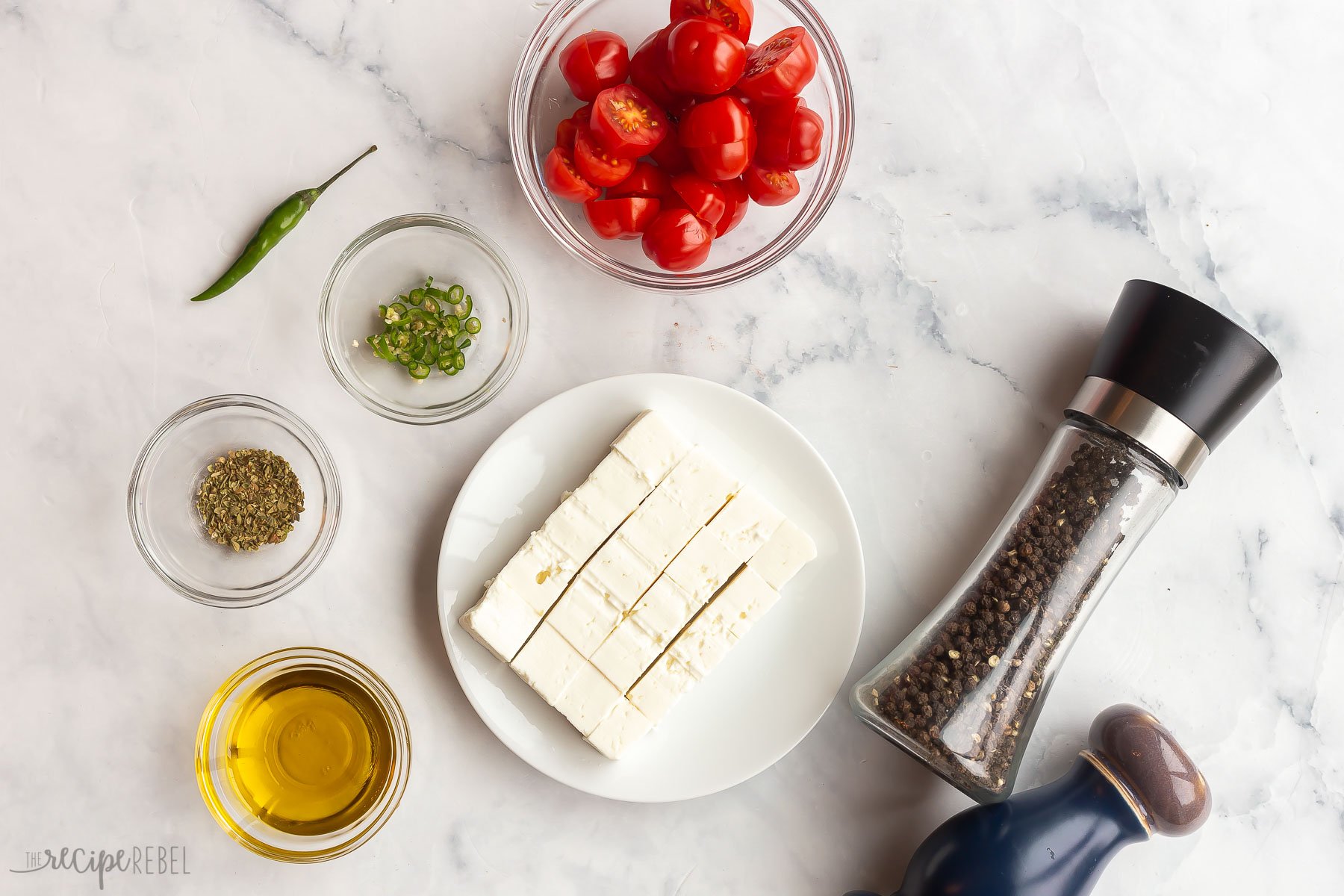 ingredients needed for baked feta with tomatoes and chilis.