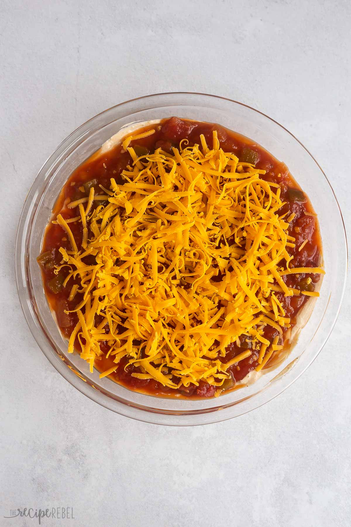 cheddar cheese on top of salsa.