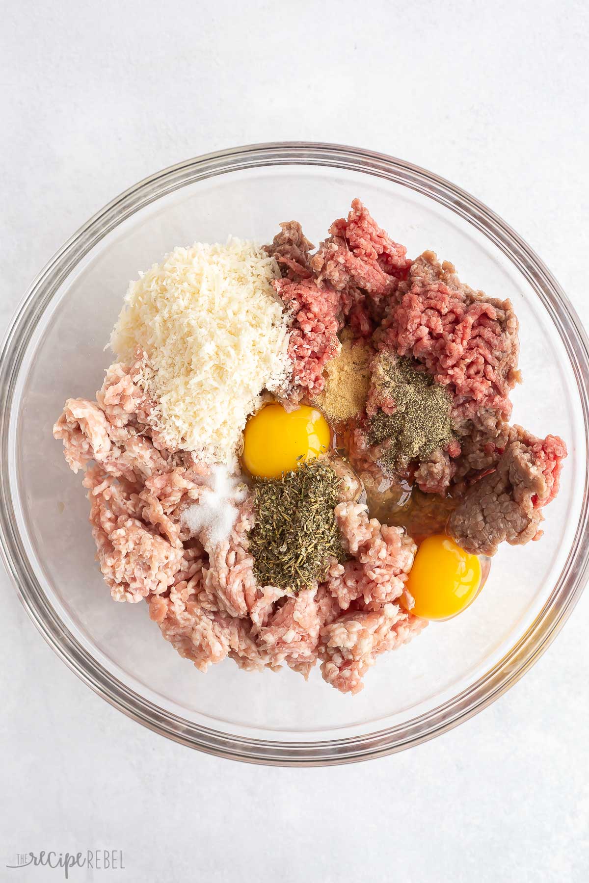 meatloaf ingredients in glass bowl.