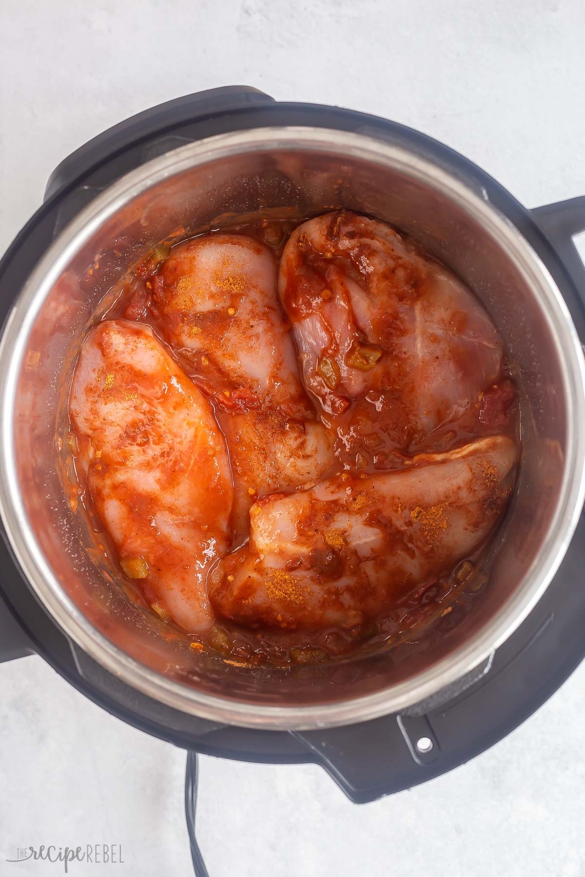 salsa on top of chicken breasts in instant pot.