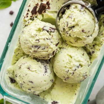 overhead image of four scoops of mint chip ice cream in glass loaf pan.