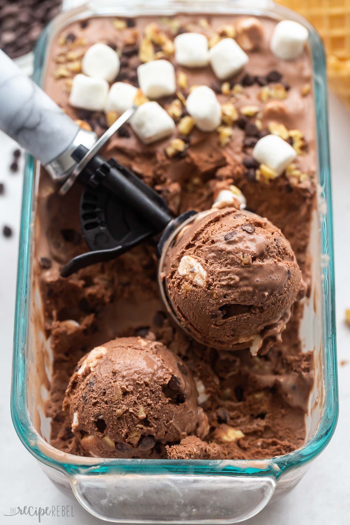 close up image of scoop of rocky road ice cream in pan.