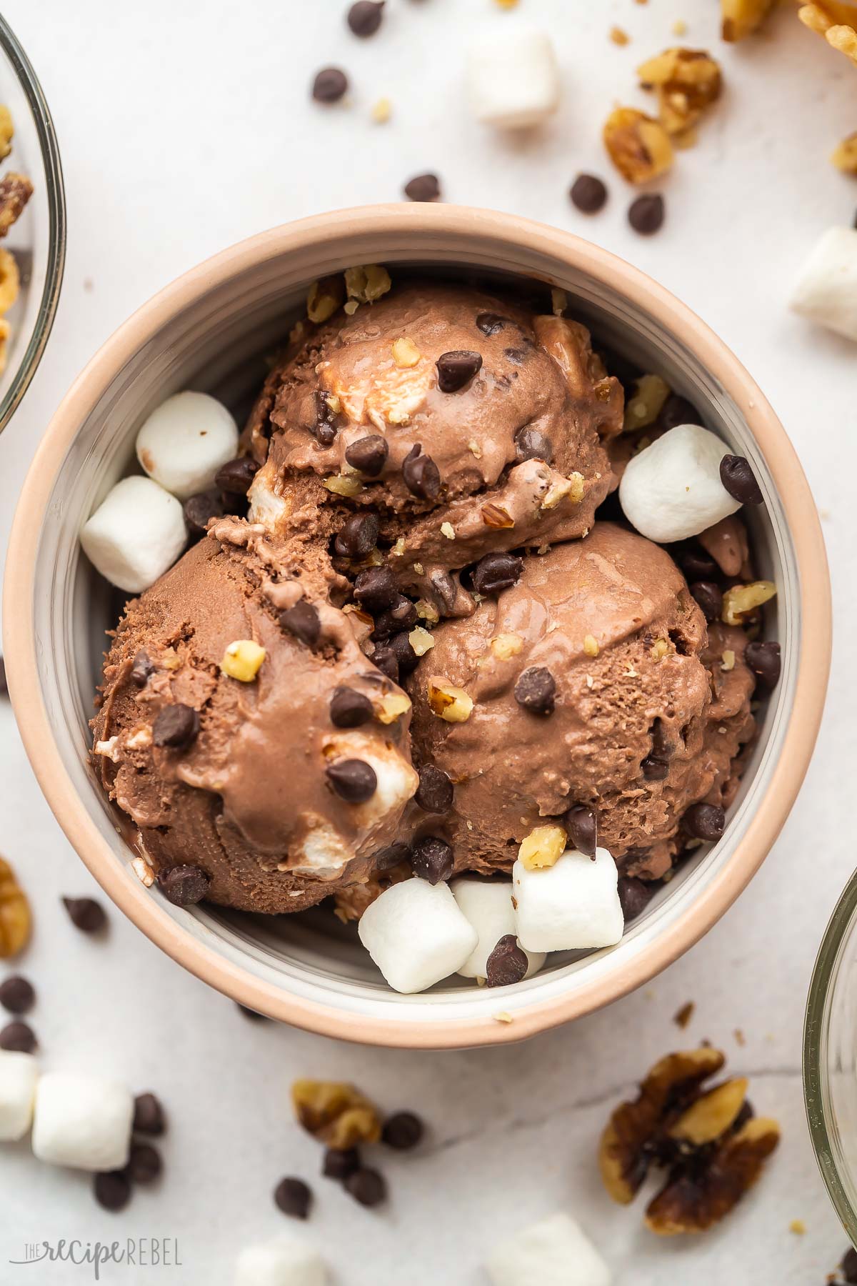 bowl with three scoops of rocky road ice cream with marshmallows.