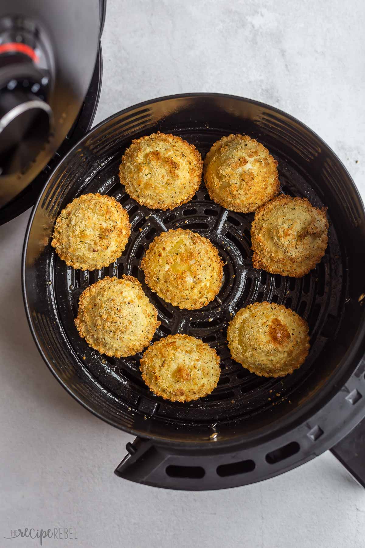 fried ravioli coming out of air fryer.