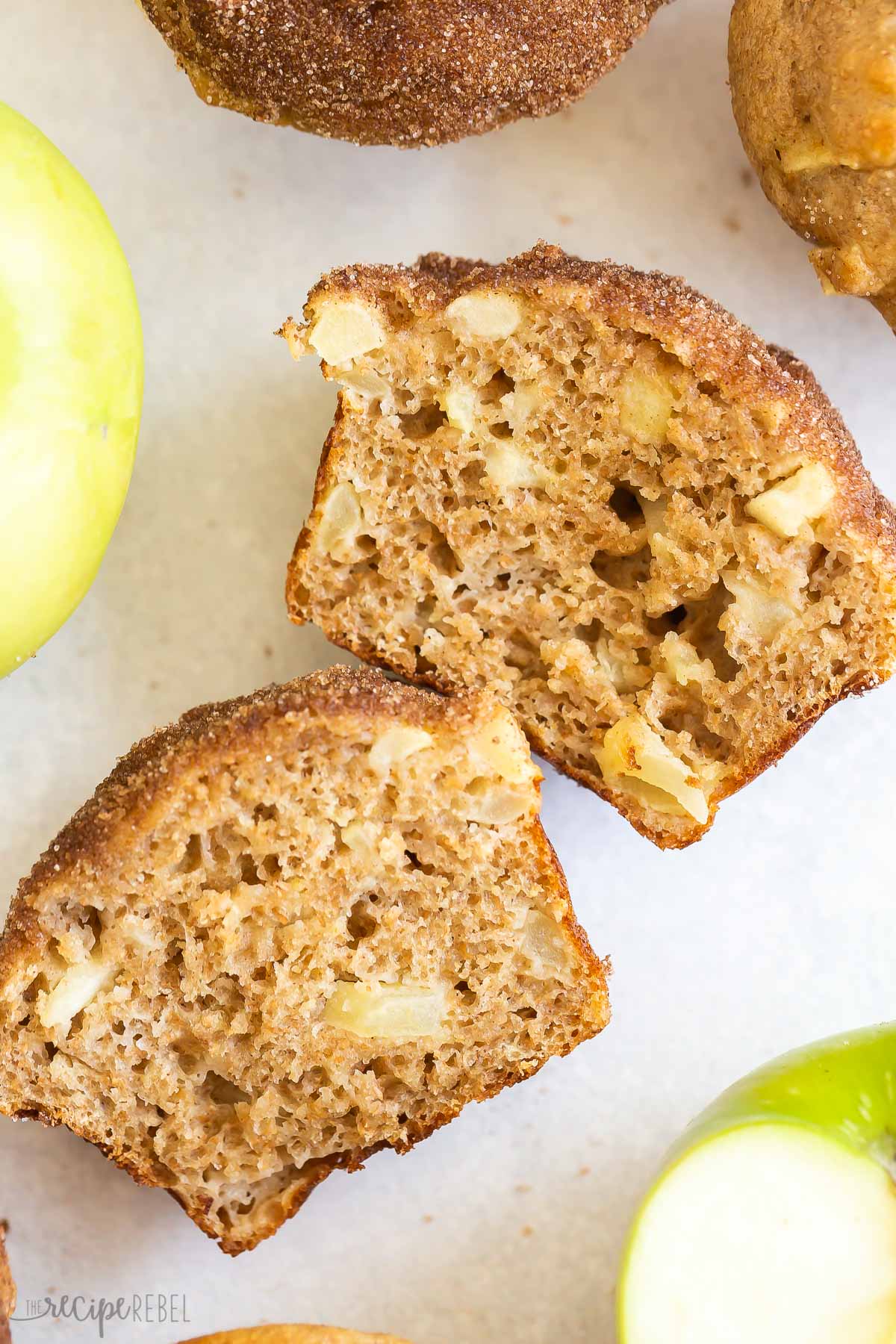 apple muffin cut in half laying on side.