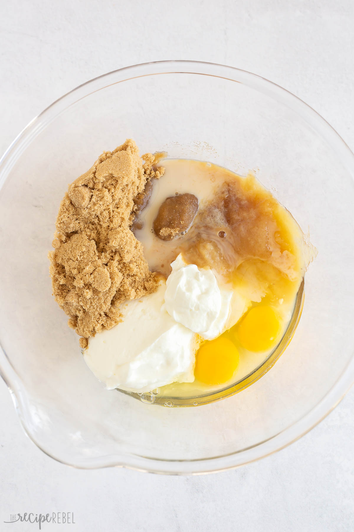 wet ingredients mixed together in glass bowl.