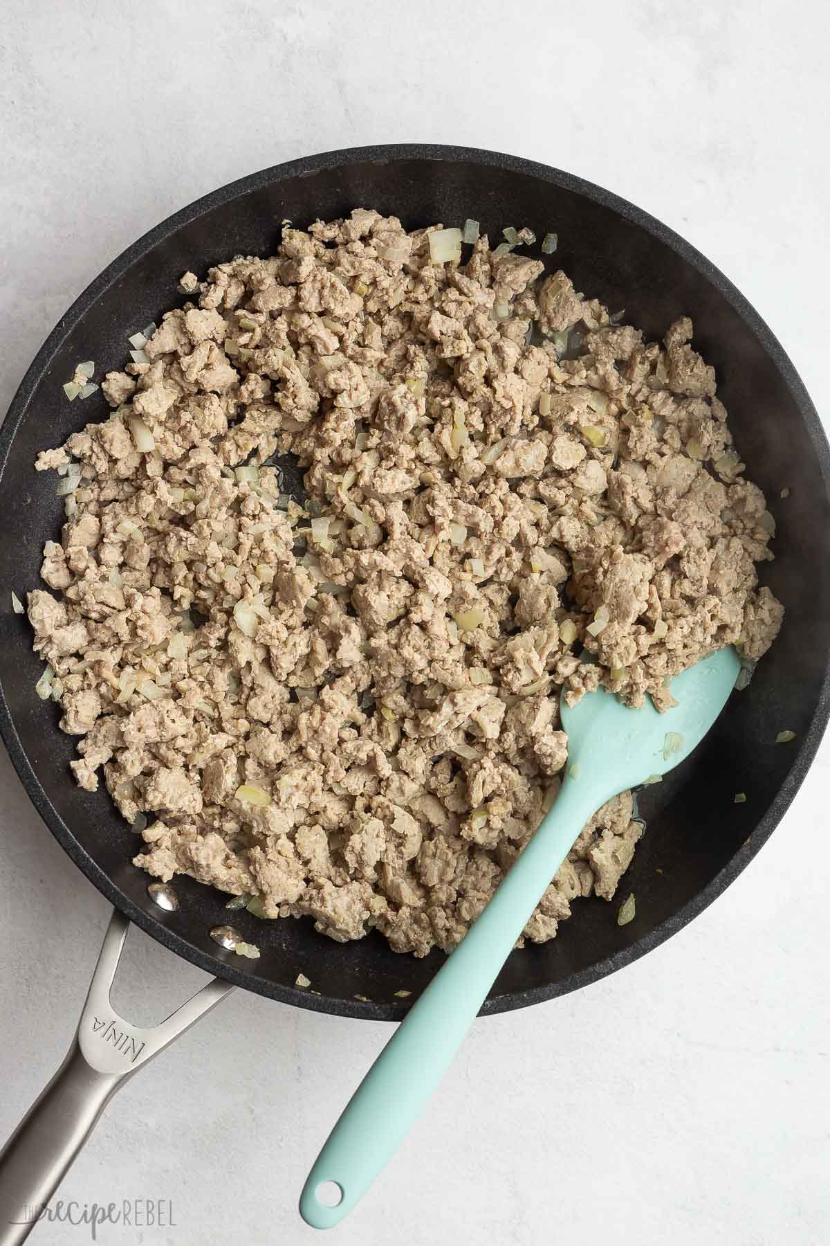 ground turkey cooked in a skillet.