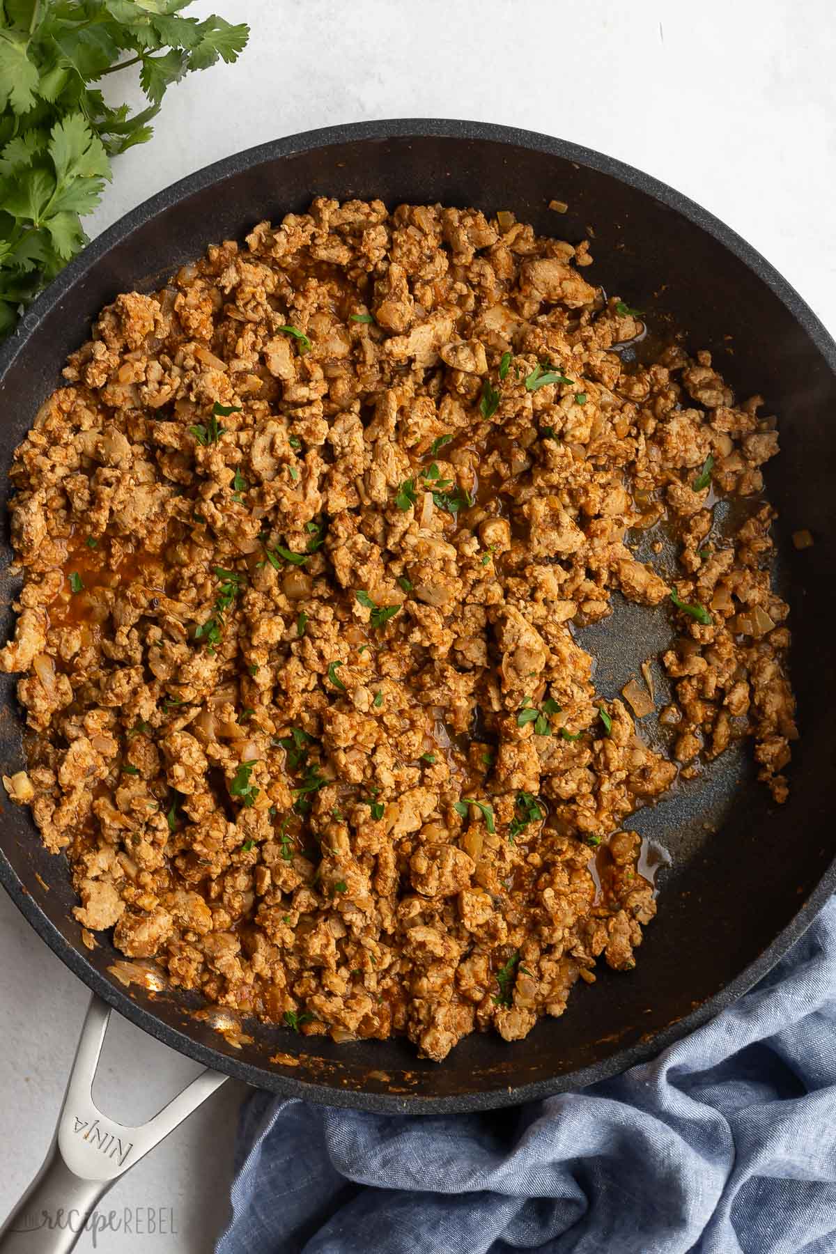 ground turkey taco mixture in black skillet.