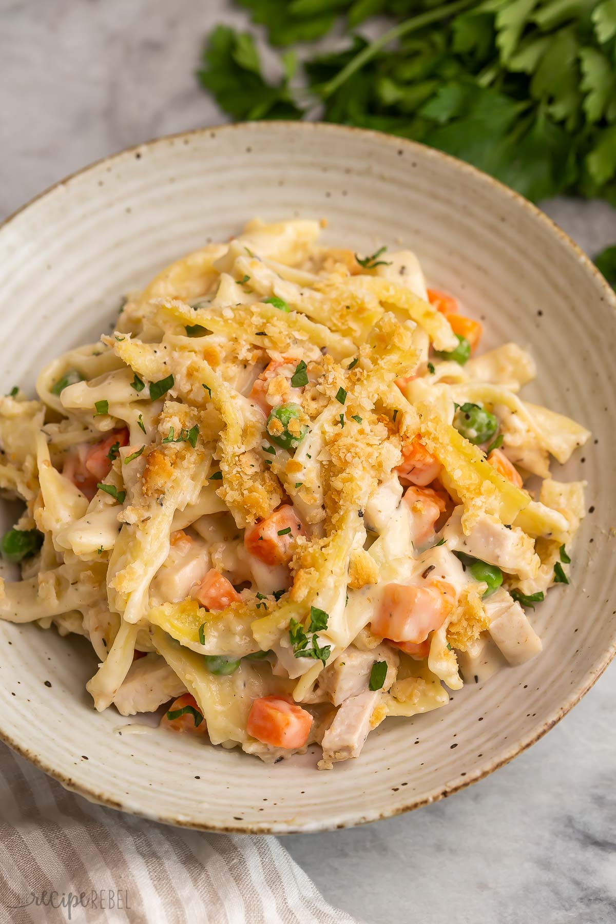 chicken noodle casserole on beige plate.