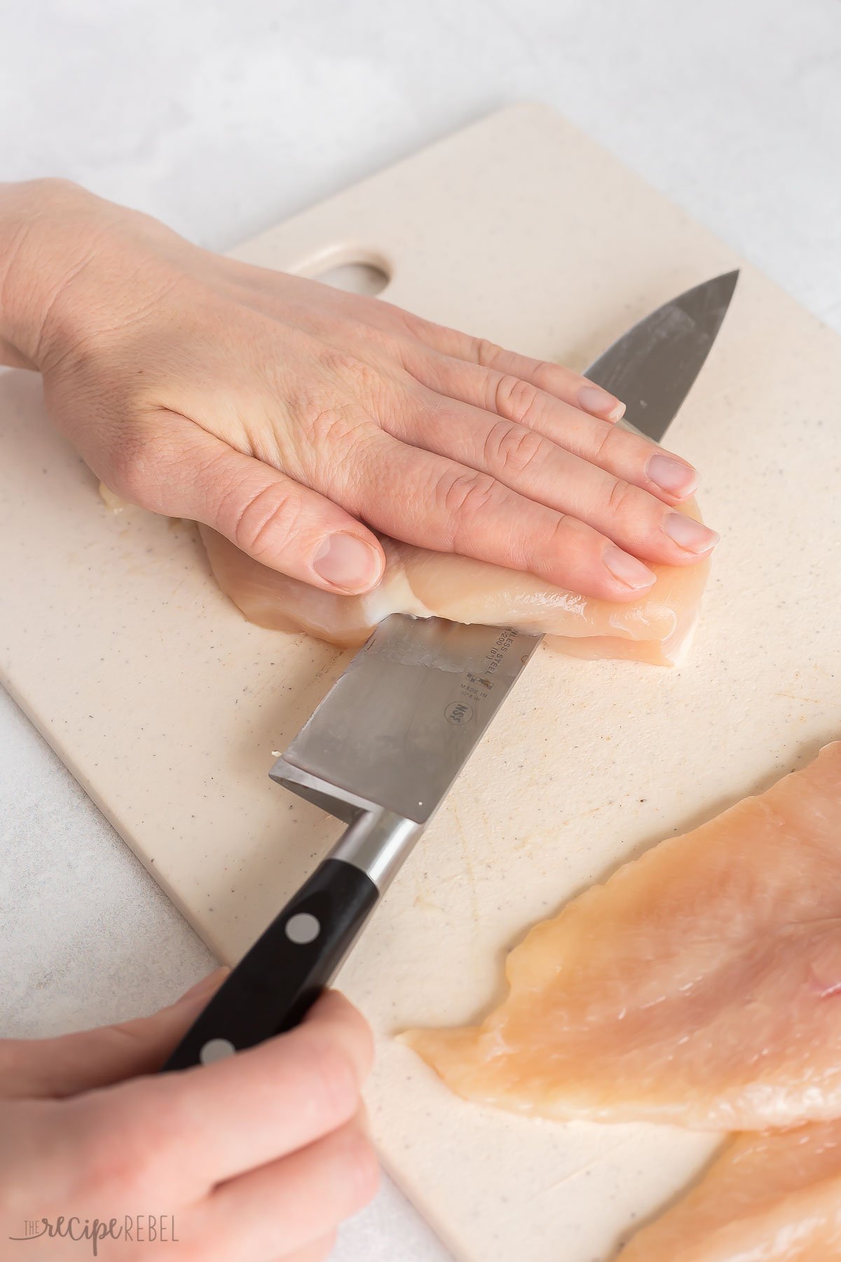 how to use a knife to butterfly chicken breasts.