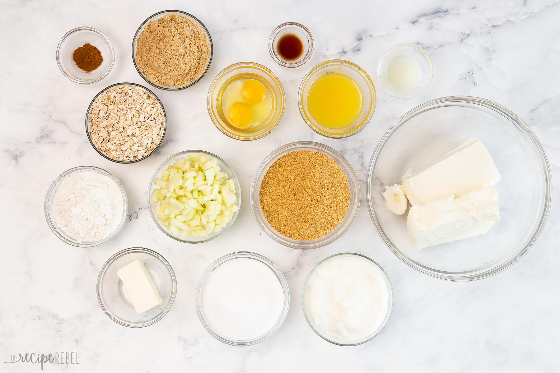 ingredients needed to make apple crisp cheesecakes.