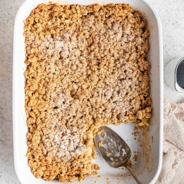 overhead image of apple crisp french toast in white baking dish.