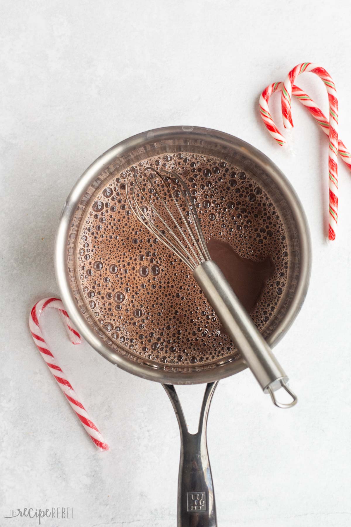 milk cocoa and sugar heated through in saucepan.