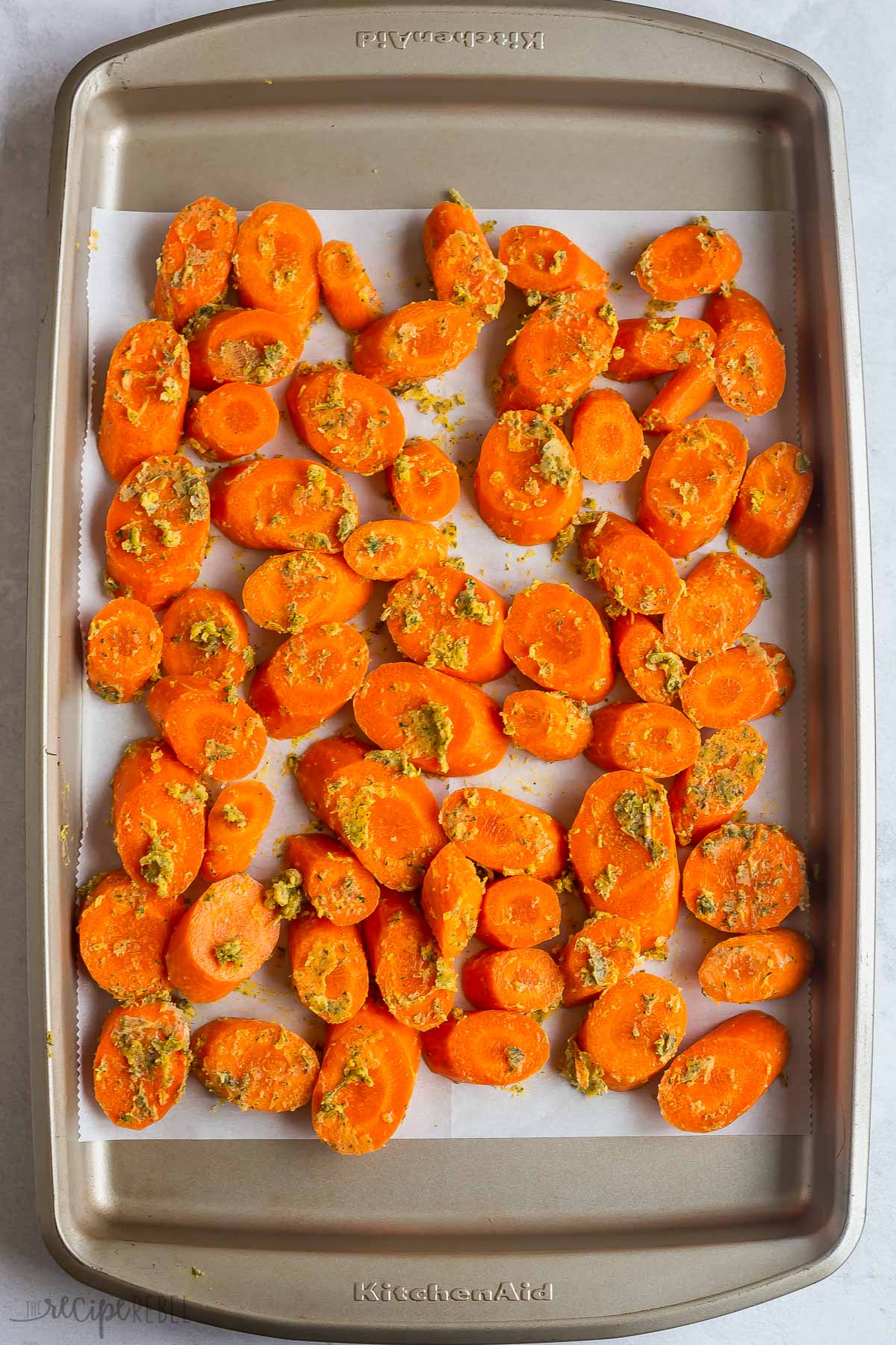 sliced carrots on sheet pan ready for roasting.