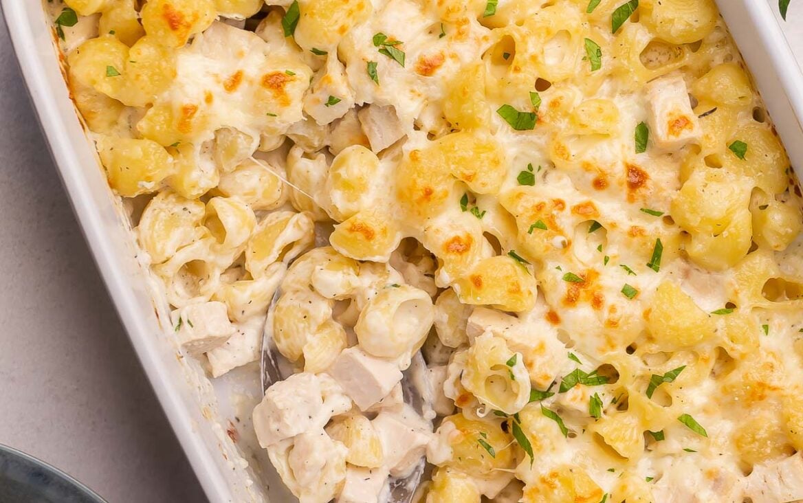 overhead image of chicken alfredo bake with spoon stuck in.