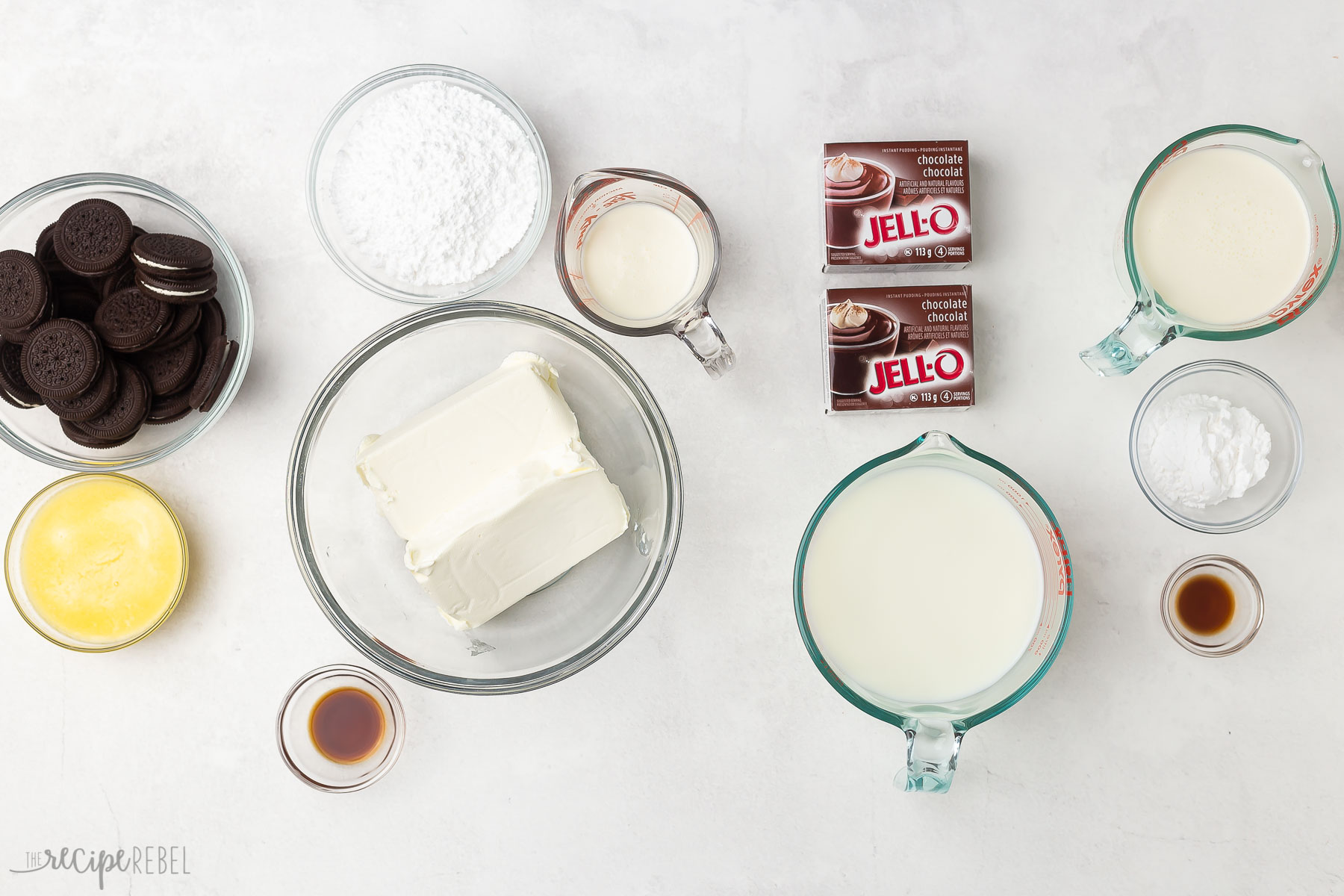 overhead image of ingredients for chocolate lasagna on light grey background.