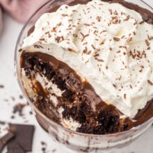 chocolate trifle in glass bowl with shaved chocolate.