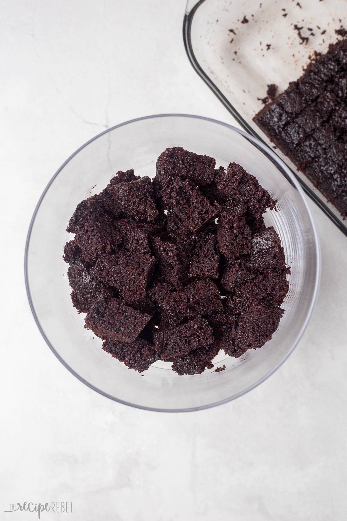 cubed chocolate cake in glass bowl.