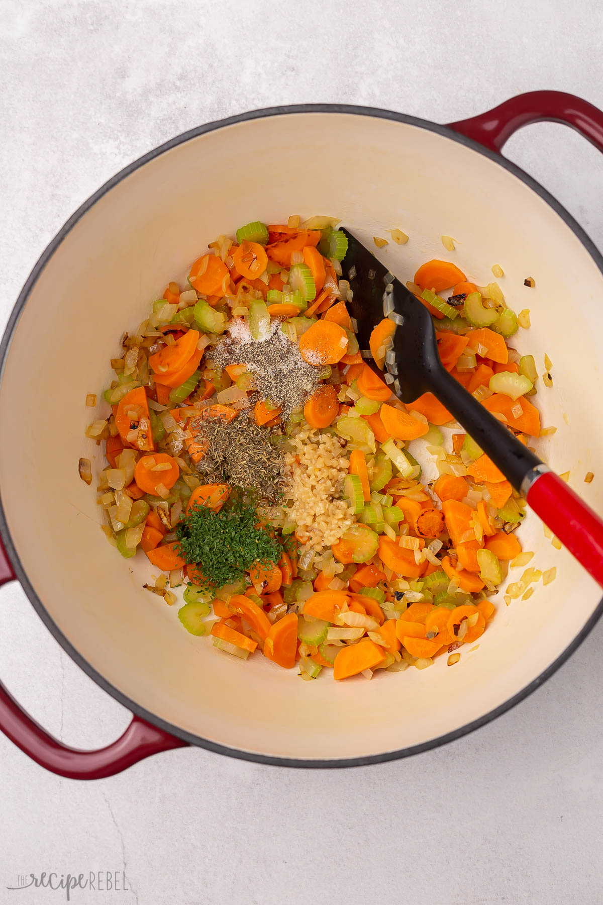 sauteed vegetables and spices in dutch oven.
