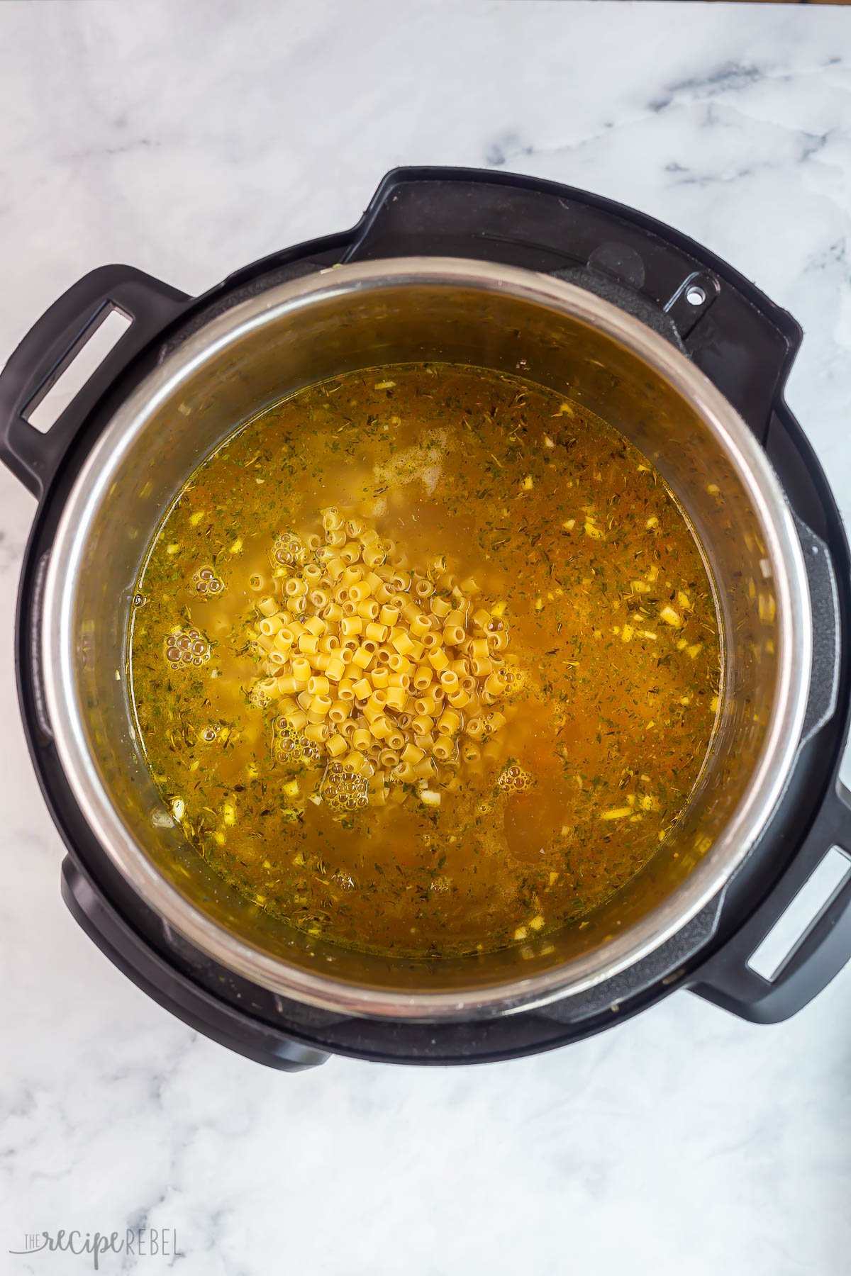 broth and dry pasta added to instant pot to make soup.