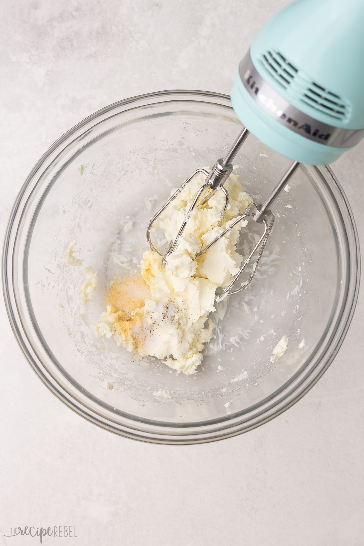 cream cheese mixture in a glass bowl with electric mixer.
