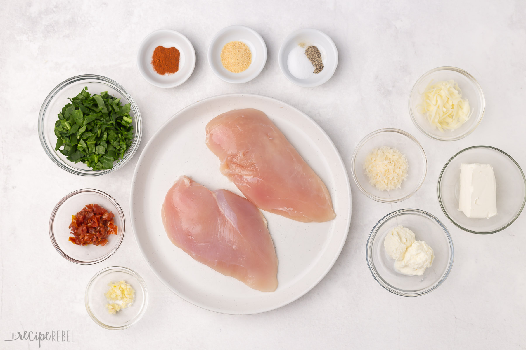 Overhead shot of ingredients for spinach stuffed chicken breasts.