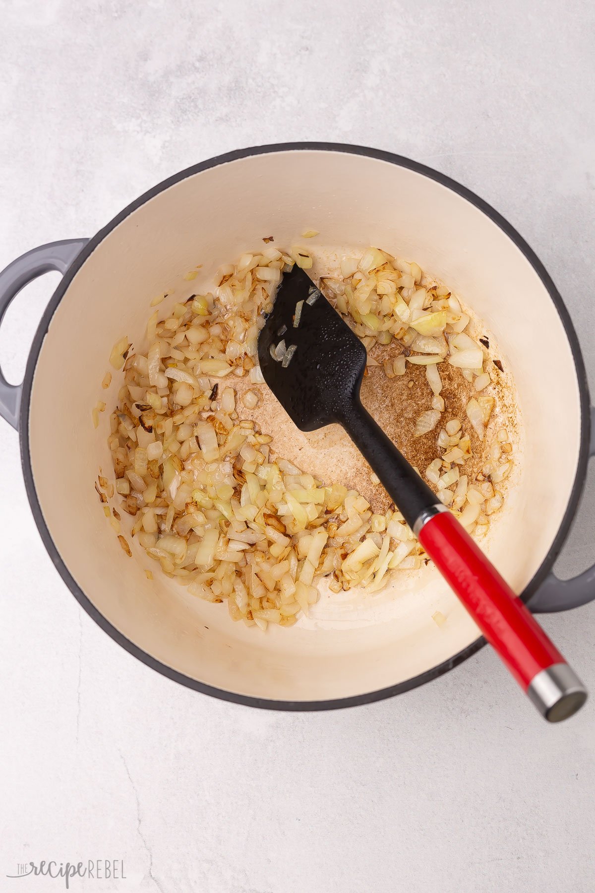 chopped onions sauteing in a dutch oven.