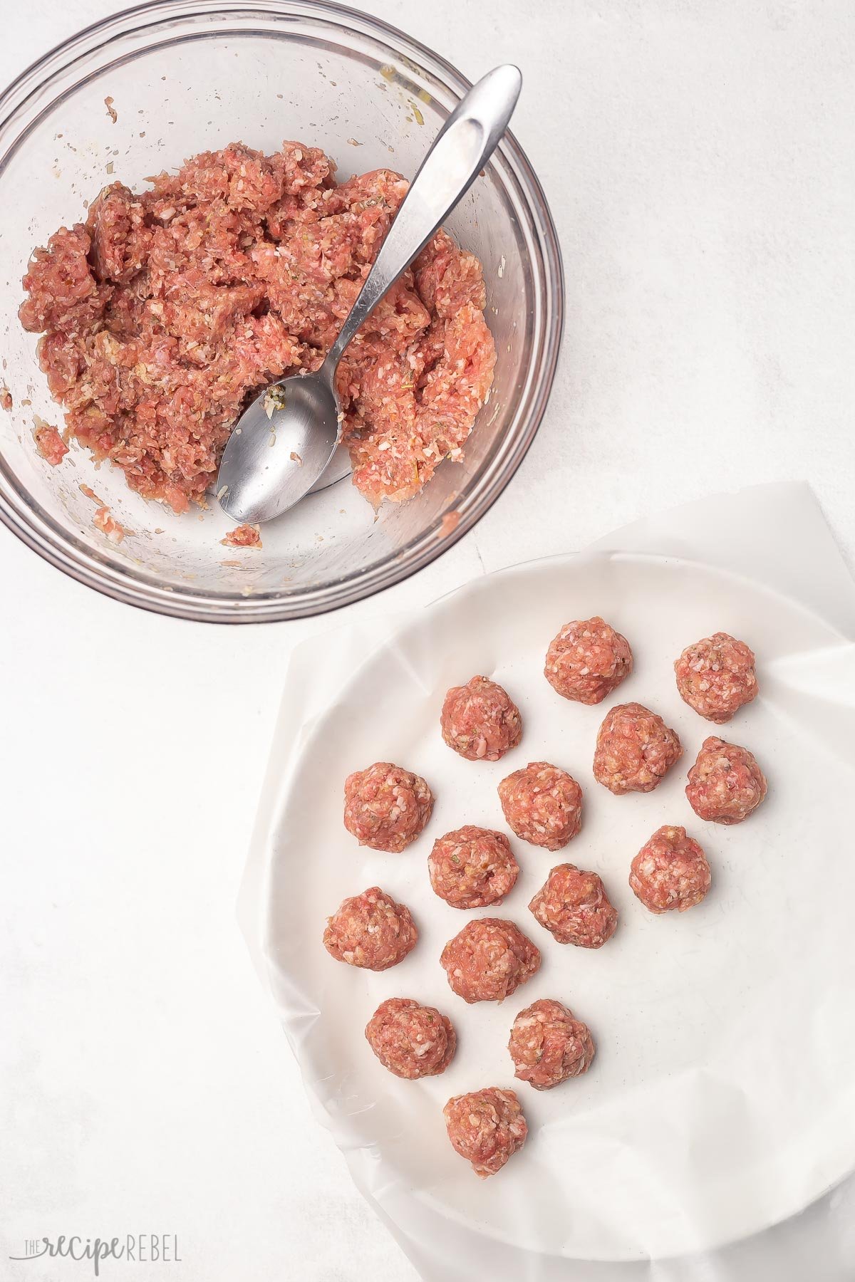 bowl of ground meat with formed meatballs on a plate.