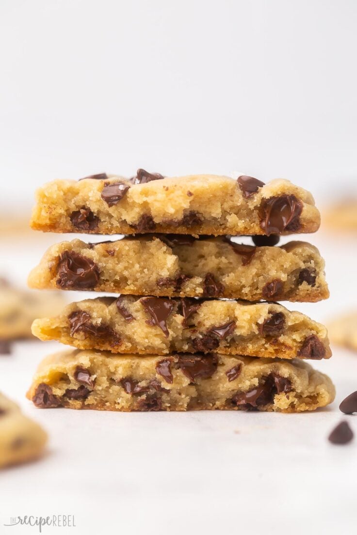 close up of four chocolate chip cookies stacked up.