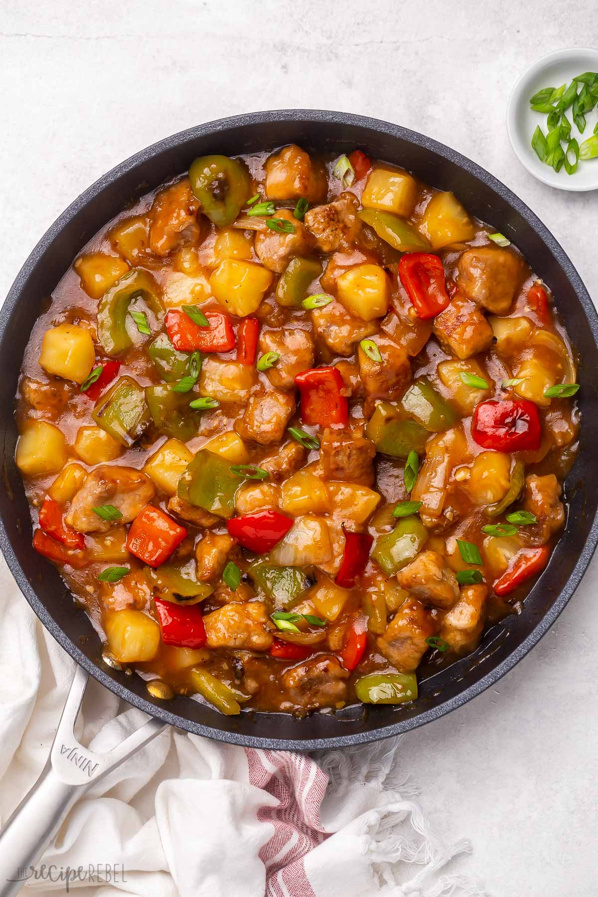 Top view of sweet and sour pork in a frying pan. 