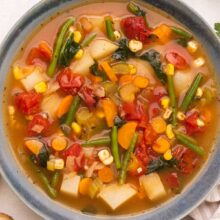 Top view of vegetable soup in a bowl.