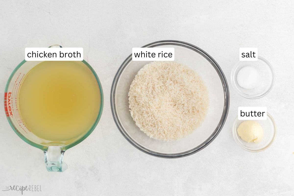 Top view of ingredients needed for baked rice in glass bowls on a grey surface.