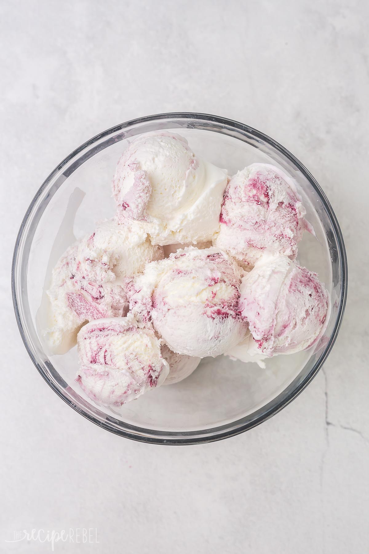 blueberry cheesecake ice cream in a glass bowl.