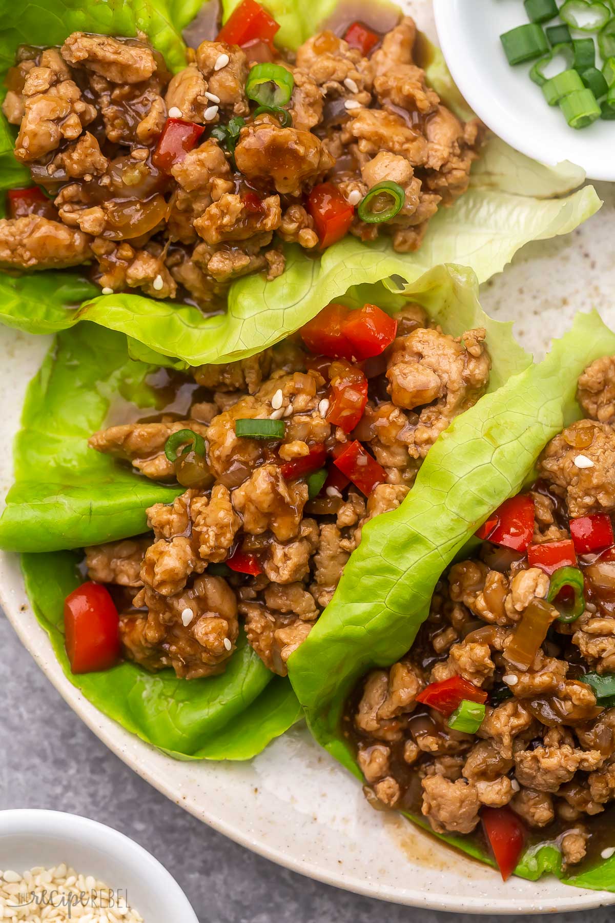 close up of chicken lettuce wraps lying on a plate.