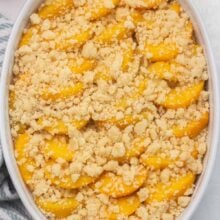 Top view of Peach Cobbler French Toast in a casserole dish.