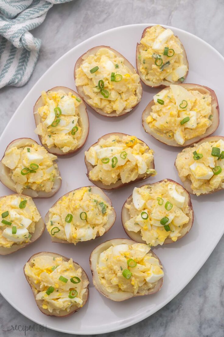 overhead view of large white plate filled with potato salad bites.