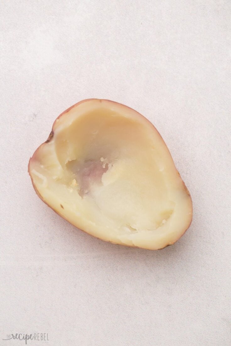 half a cooked potato with centre scooped out.