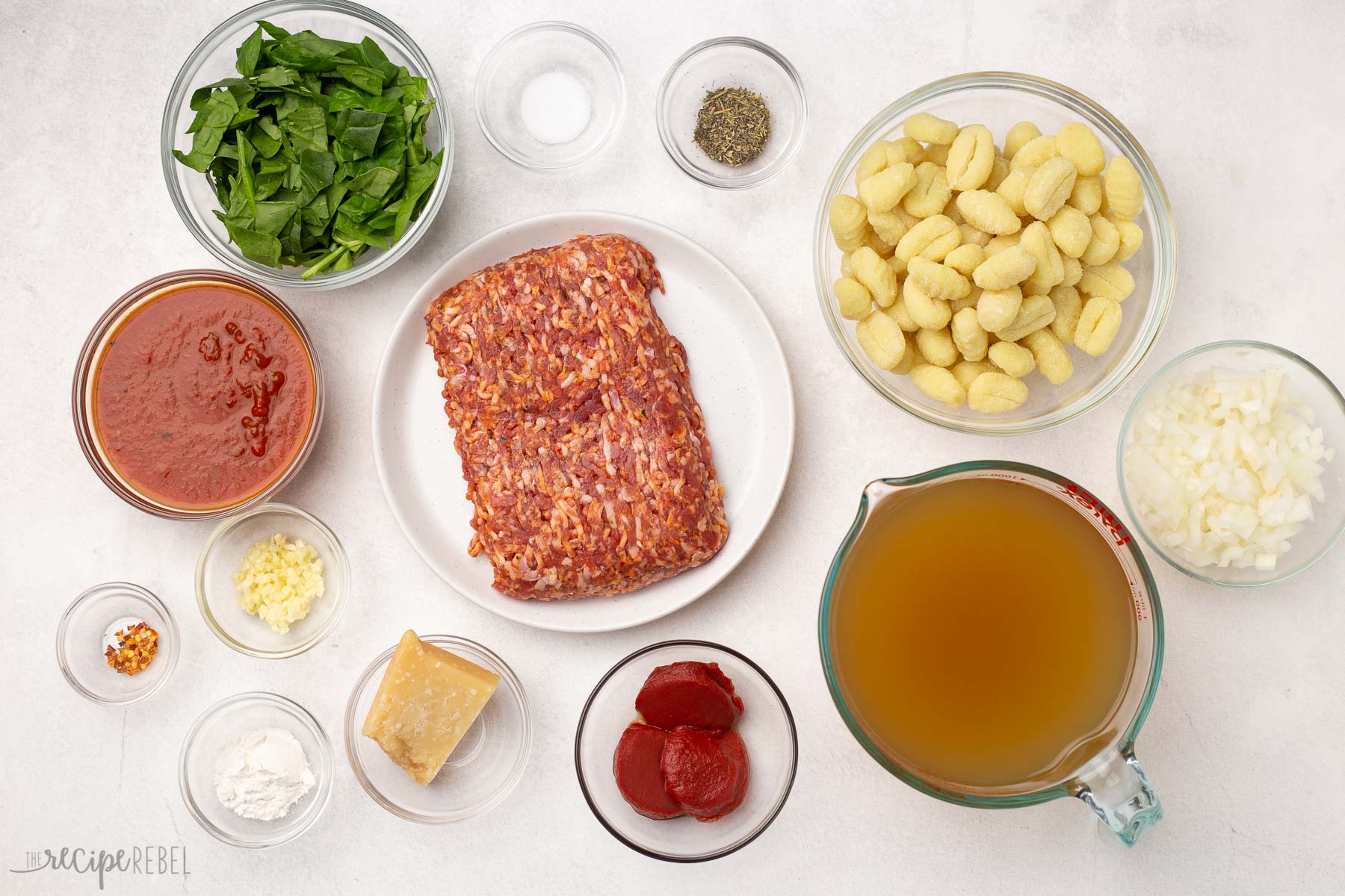 Top view of ingredients needed to make sausage gnocchi soup.