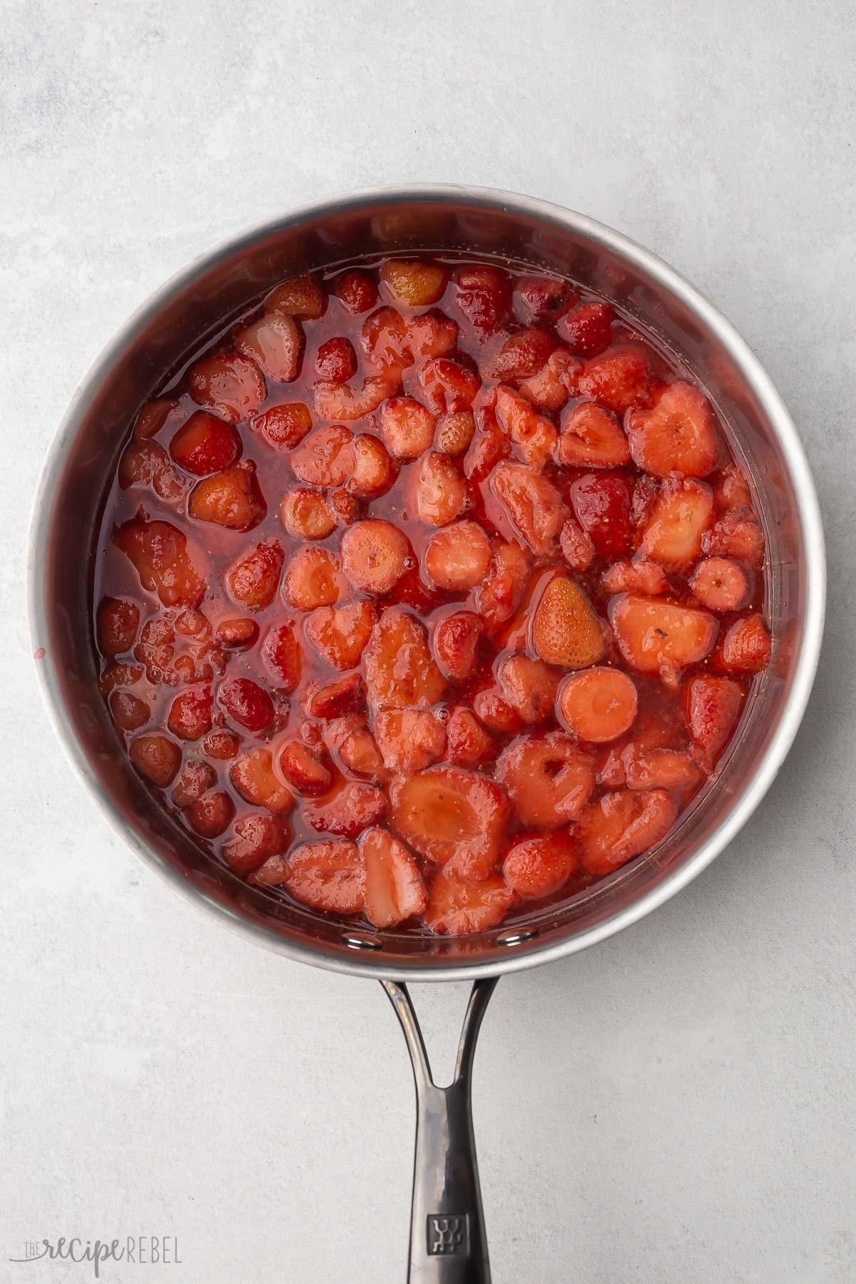Top view of cooked strawberry mixture in a pan.