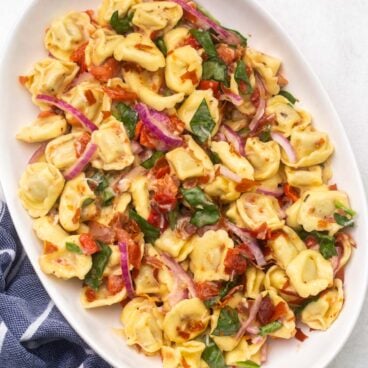 close up view of a platter of tortellini pasta salad.