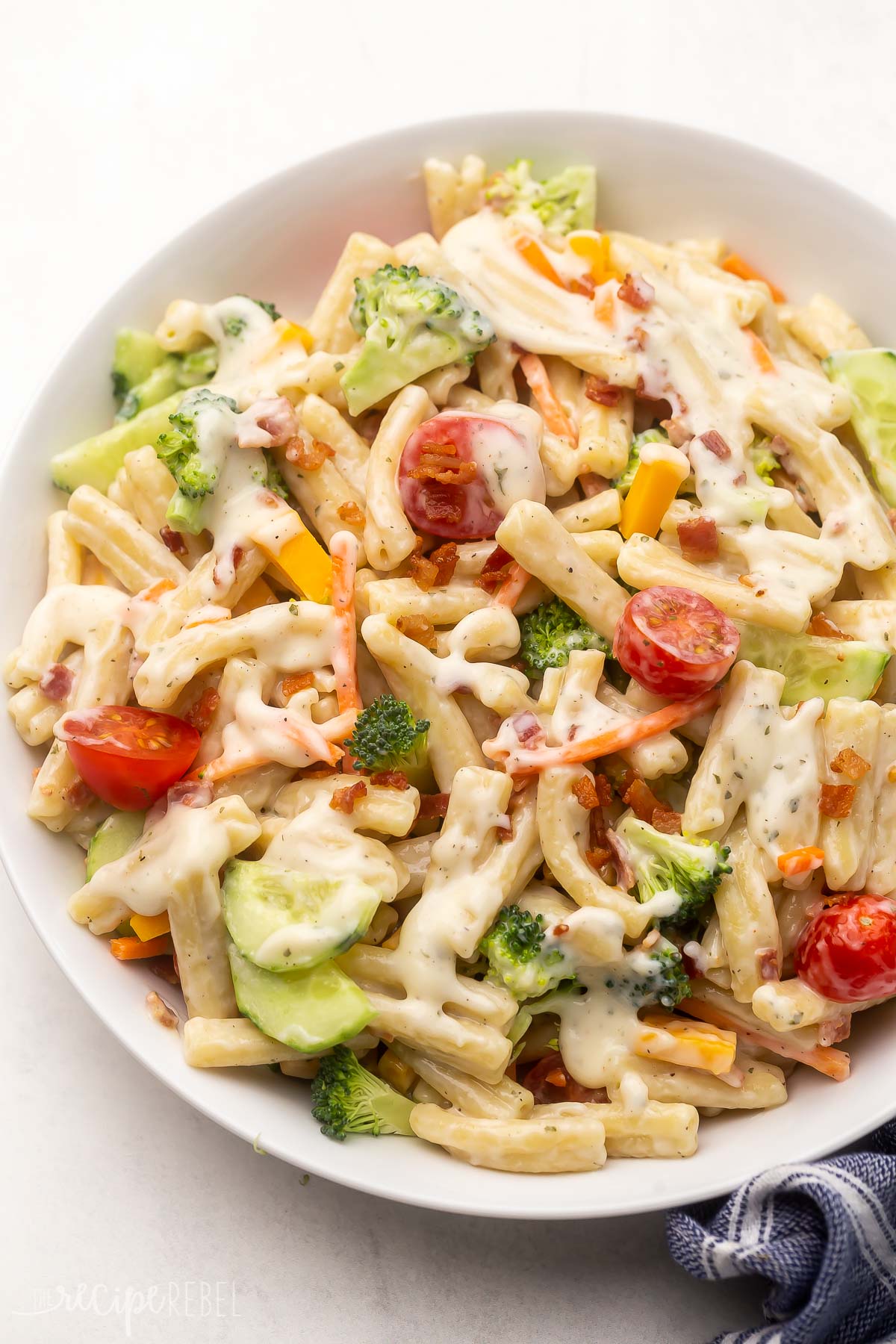 Top view of Bacon Ranch Pasta Salad on a white plate. 
