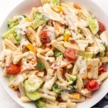 Top view of bacon ranch pasta salad on a white plate.