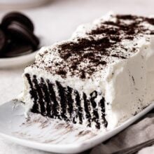 Close up of a white and chocolate Icebox Cake on a long serving plate.