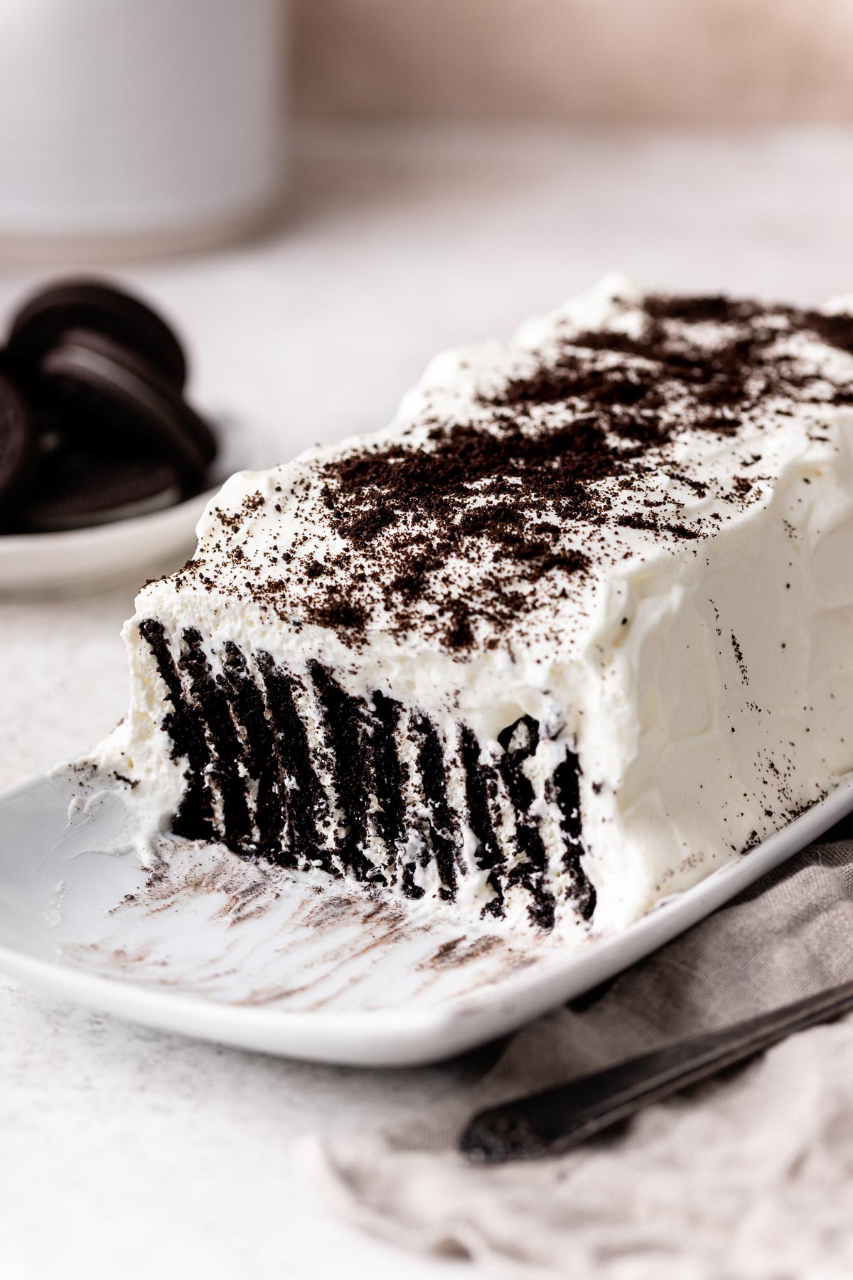 Close up of a white and chocolate Icebox Cake on a long serving plate. 