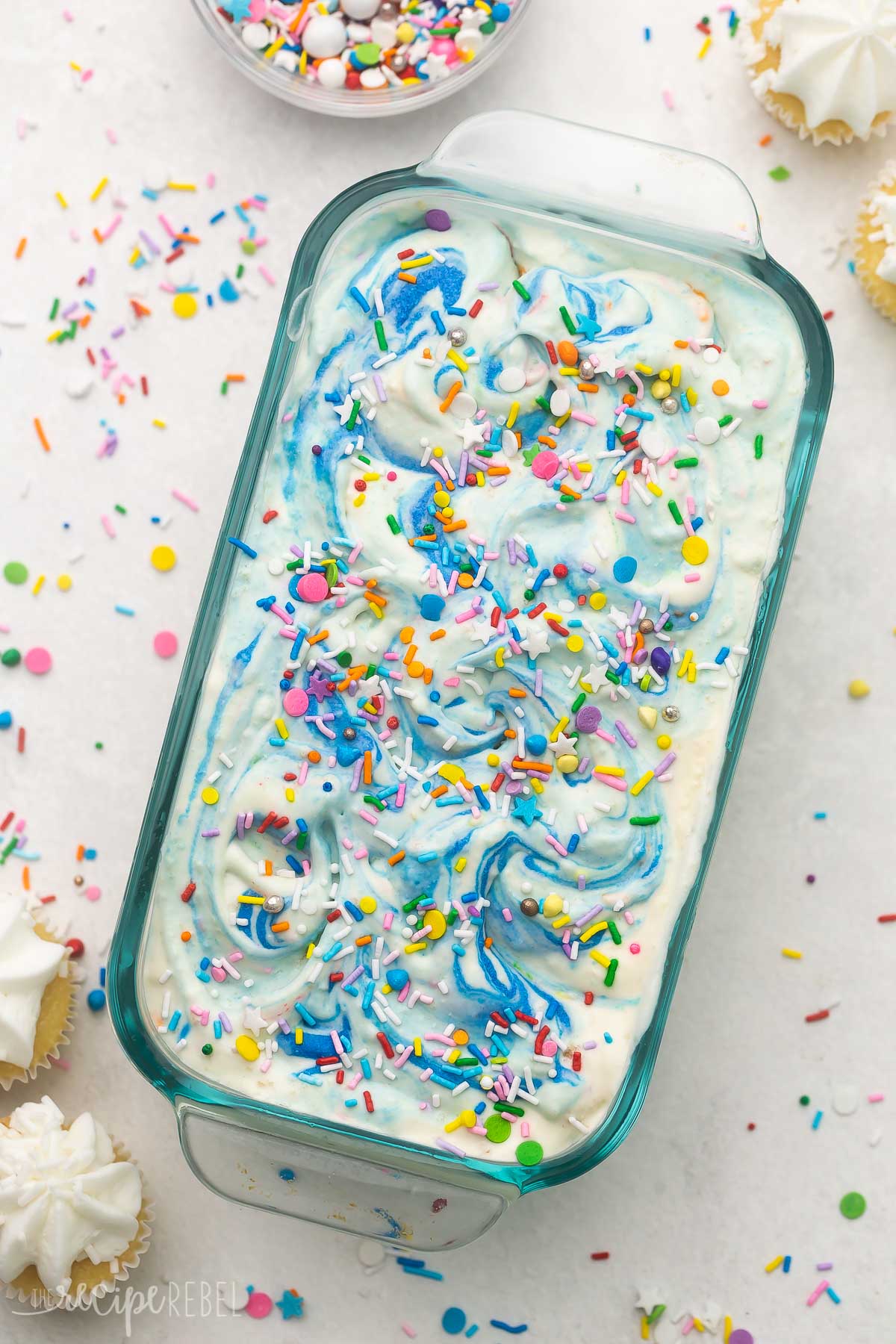 Top view close up of a glass dish filled with birthday cake ice cream.