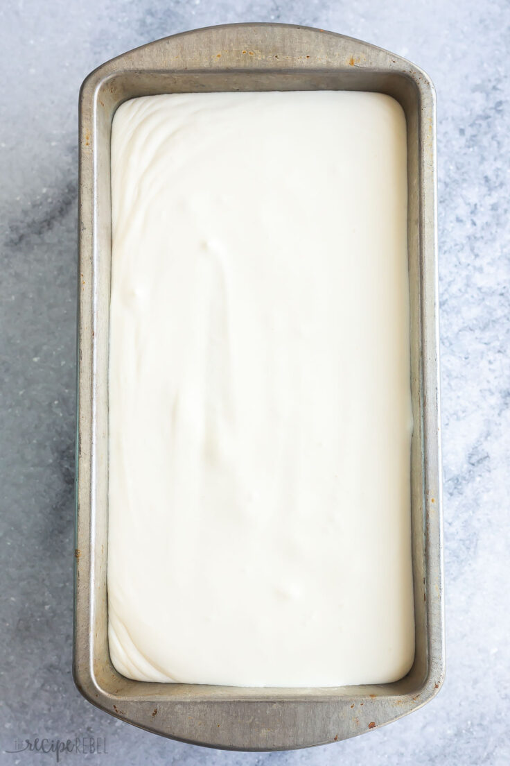 Top view of an ice cream pan with white no churn ice cream in it. 