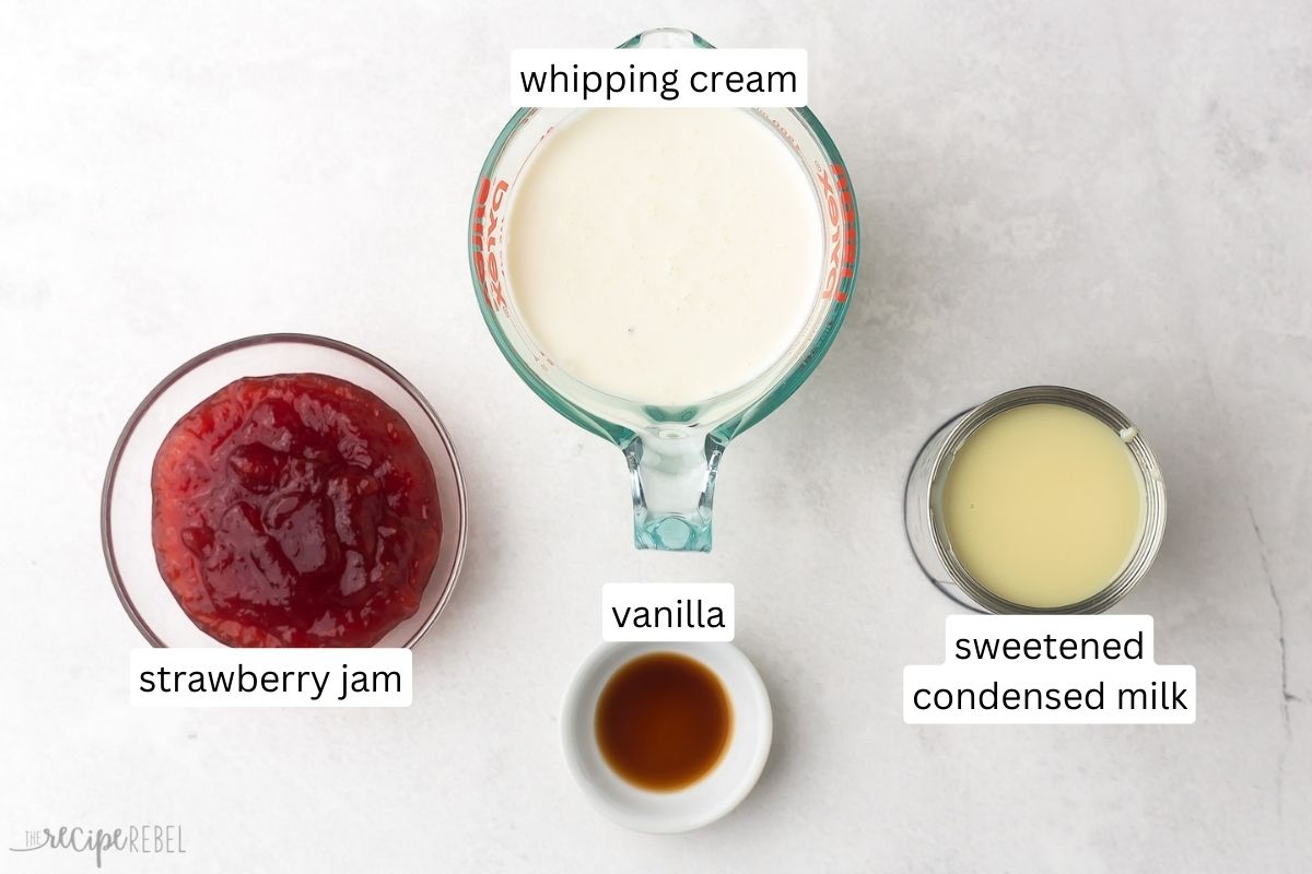 Top view of ingredients needed to make no churn strawberry ice cream in small bowls on a counter with labels edited on them.