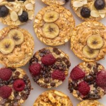 overhead shot of baked oatmeal cups on white surface.