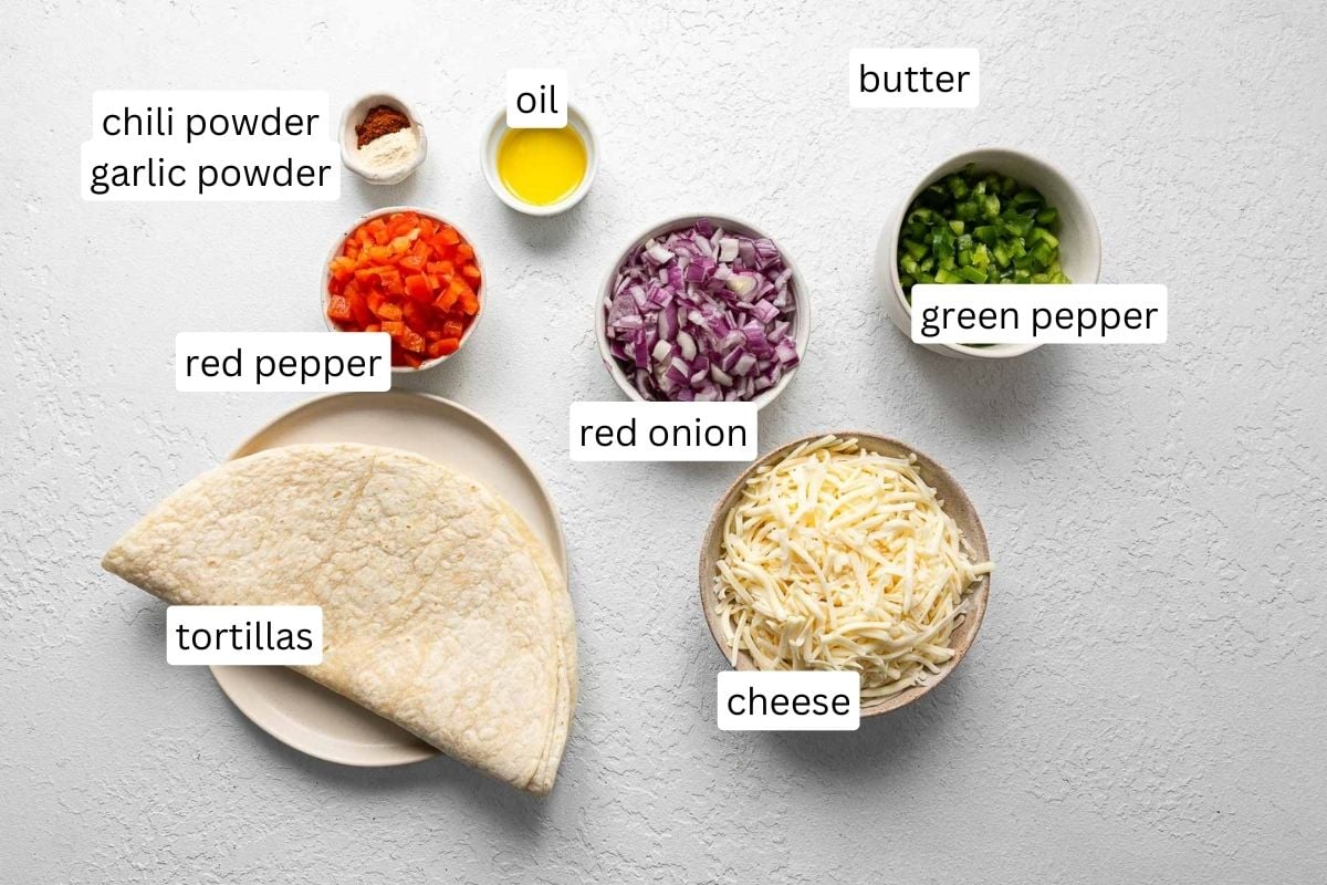 ingredients for cheese quesadillas on white surface.