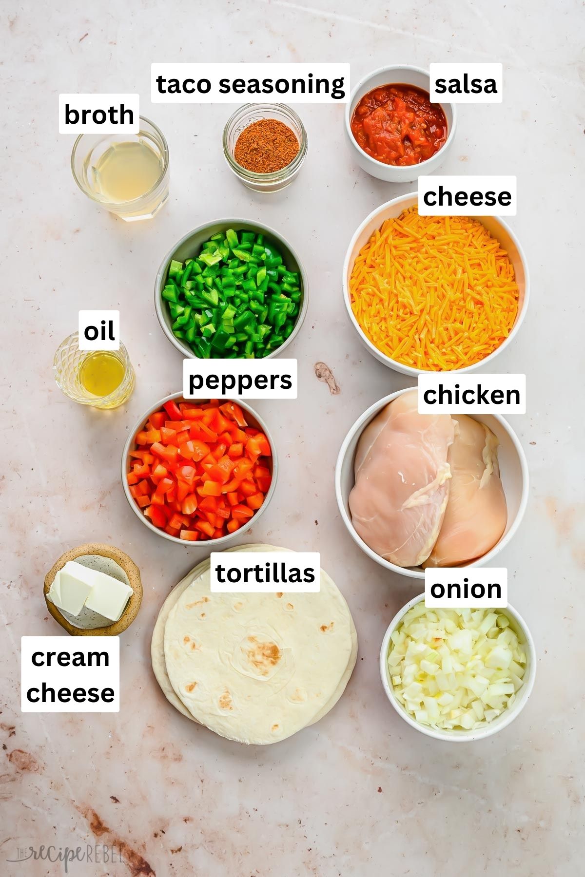 overhead shot of ingredients for chicken taquitos in glass bowls.